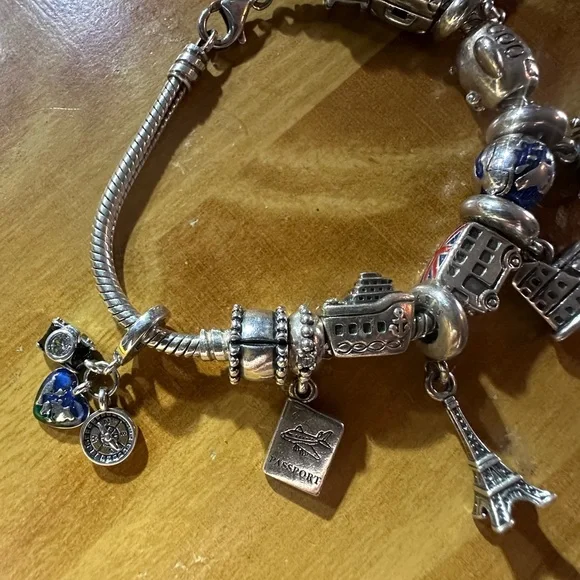 authentic Pandora Travelers charm bracelet. It’s a must have if u travel a-lot. - Picture 6 of 9